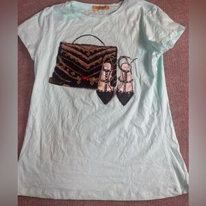 Vinizbena Embellished Handbag & Heels Graphic Tee
Size: Medium 1110